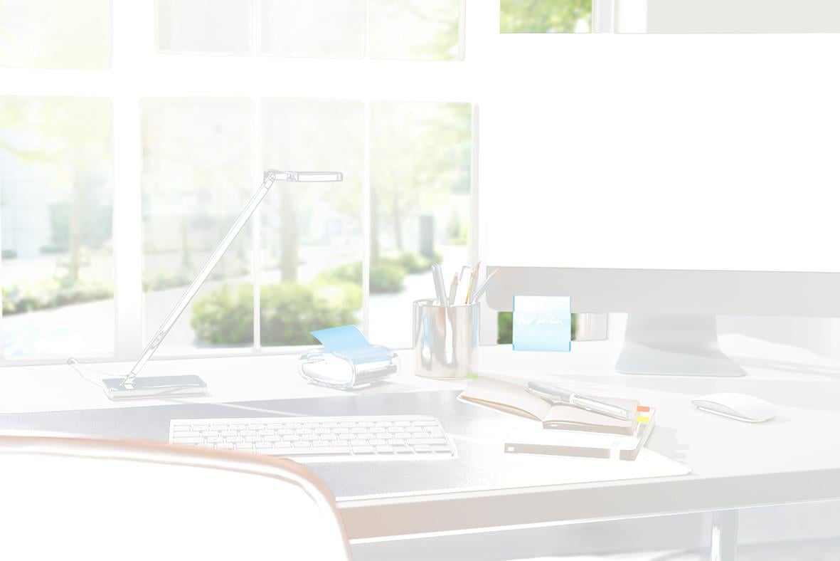 Hållare för Post-it-lappar inklusive en gul, svart och transparent lapp, 76x76mm, på ett skrivbord