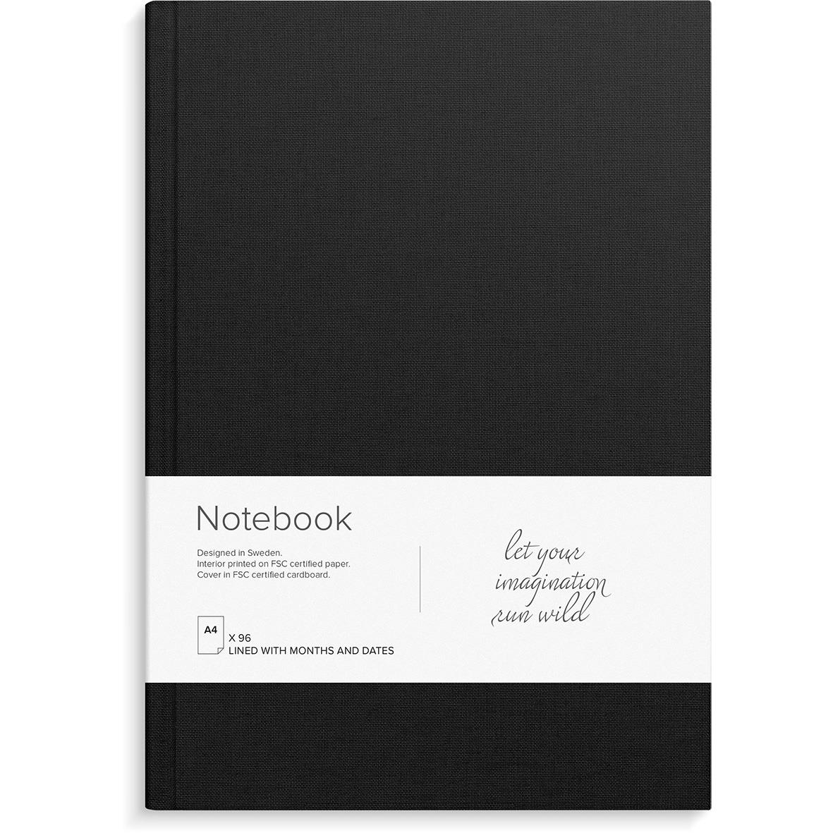 Svart anteckningsbok med vit etikett och texten let your imagination run wild