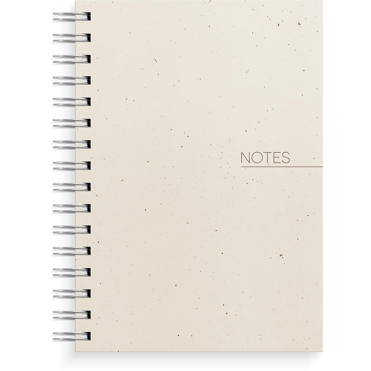 Beige spiralnotebook med linjerad sida och texten NOTES på framsidan