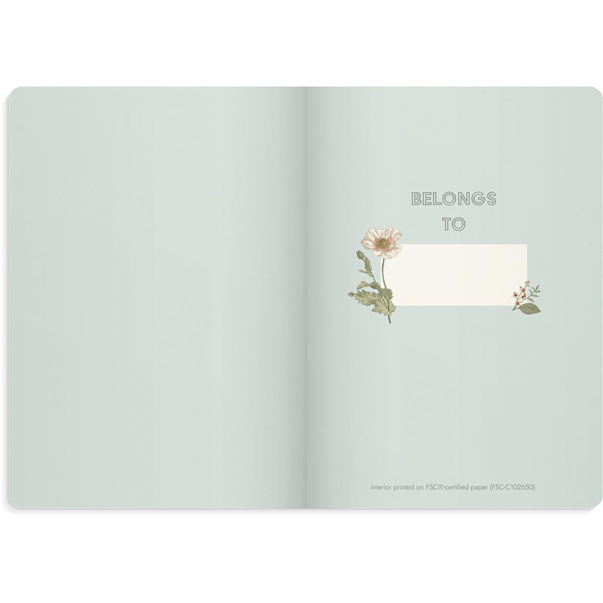 Blå linjerad anteckningsbok med blomsterdesign och text BIBLINGS TO på sidan