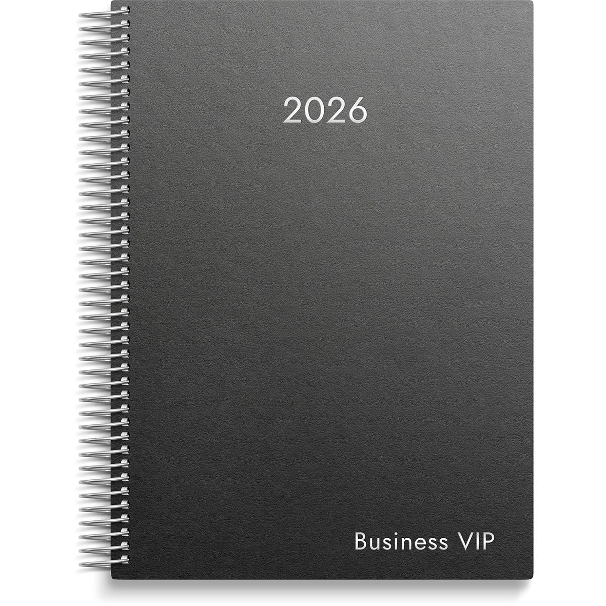 Svart spiralbunden almanacka för 2026 med text Business VIP på framsidan
