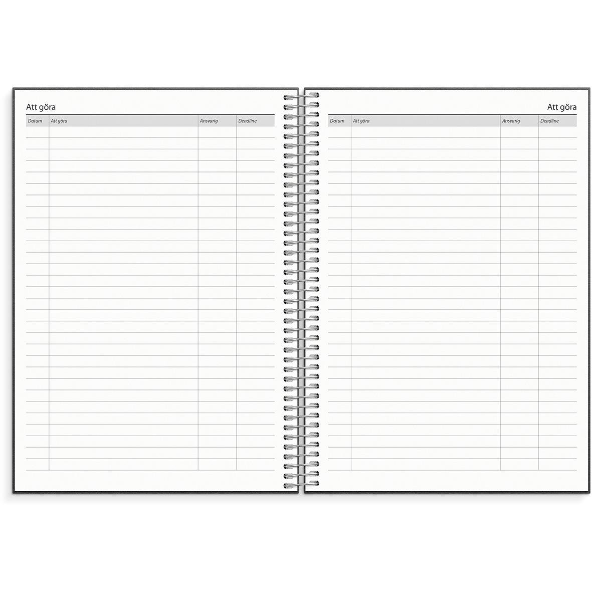 Öppnad almanacka för 2026 med tomma att göra-listor och datum