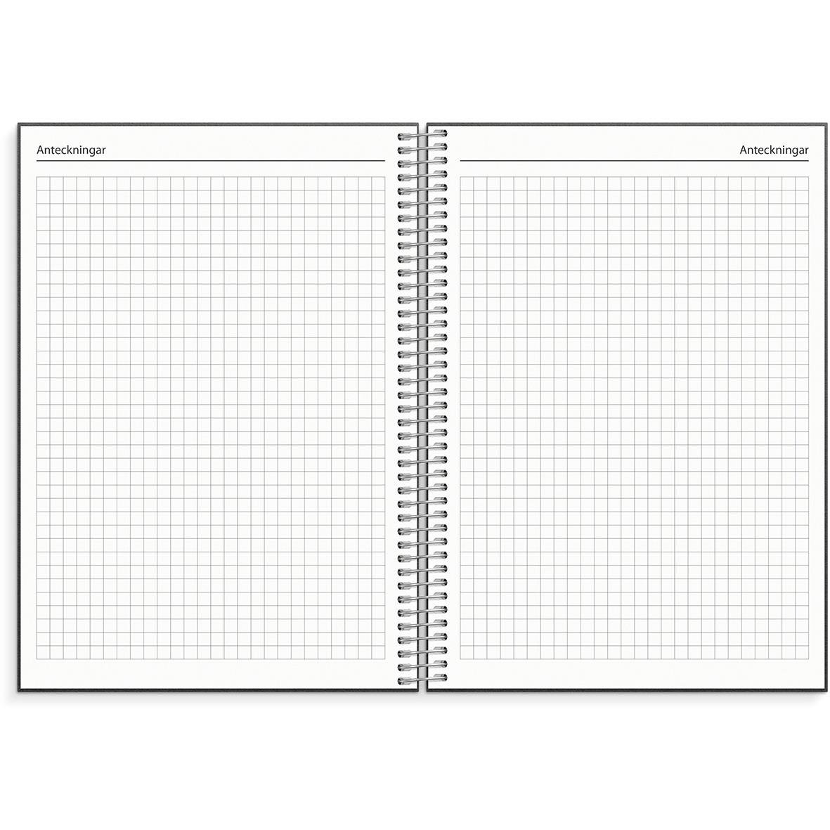 Öppen almanacka för 2026 med rutade sidor för anteckningar