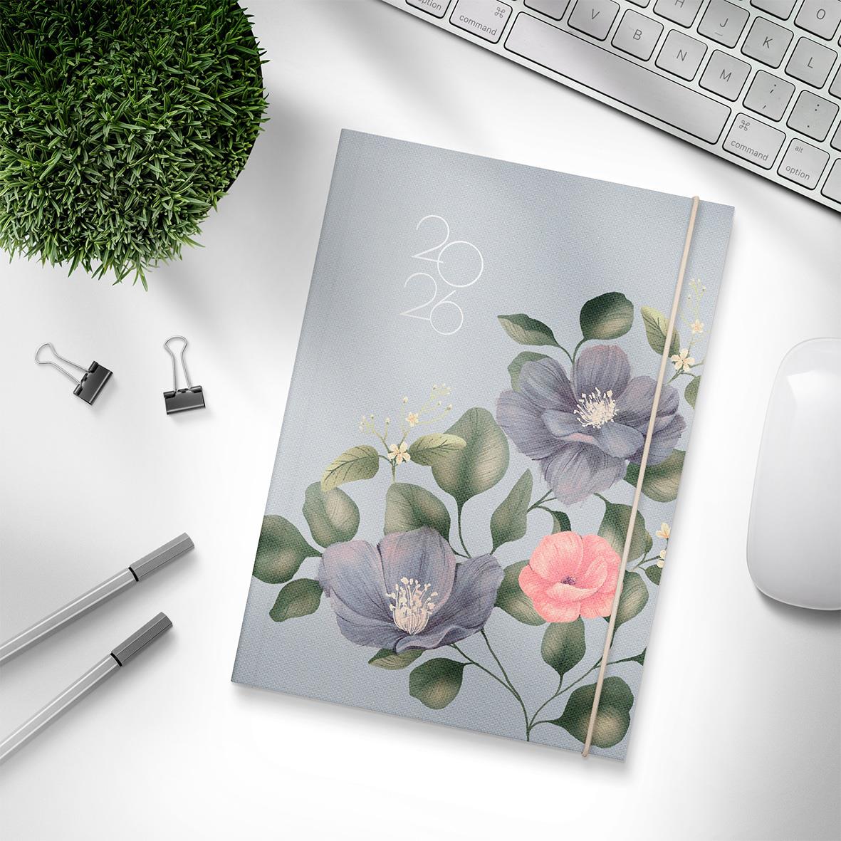 Årsalmanacka Burde 5881 Business Flora 2026 A5 med blommönster på omslaget, omgiven av kontorsmaterial