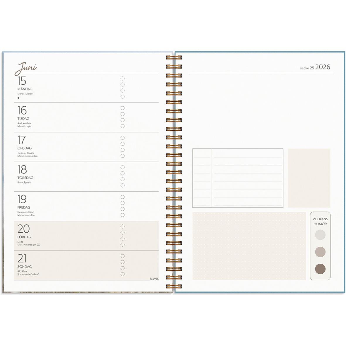 Öppnad almanacka för 2026 med veckoplanering och plats för anteckningar i A5-format
