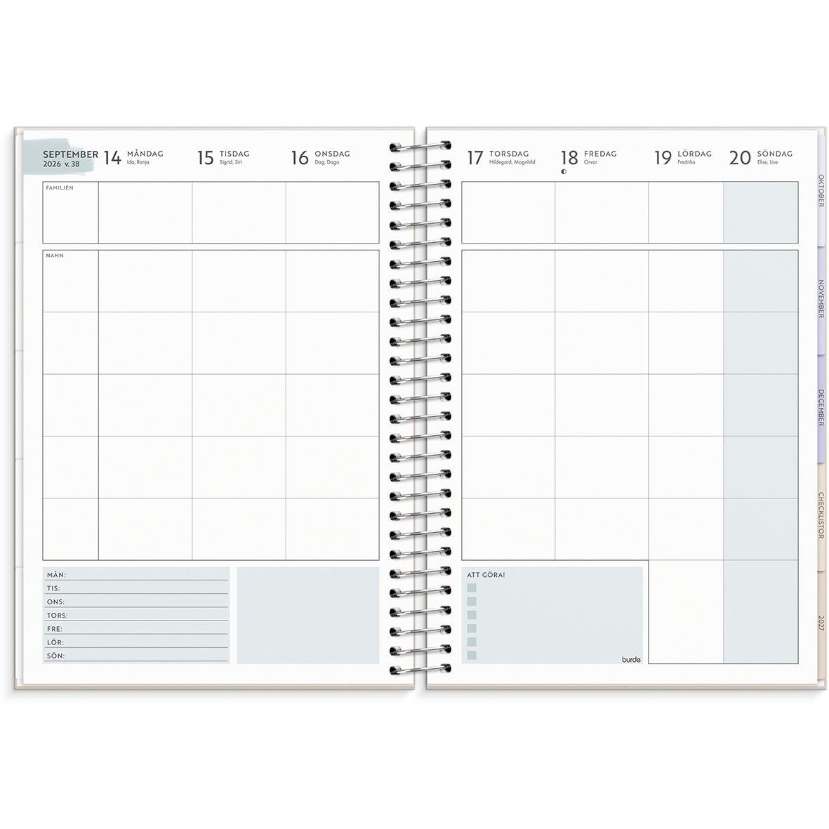 Öppen familjeplanerare och kalender för 2026 i A5-format med veckovisa vyer och plats för anteckningar