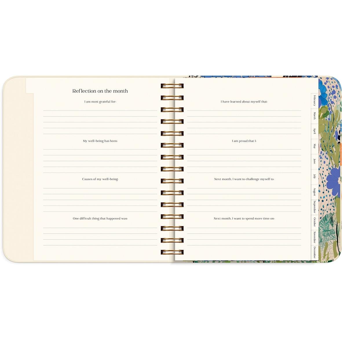 Öppen almanacka med reflektioner för månaden och utrymme för anteckningar, i färgglad design för 2026