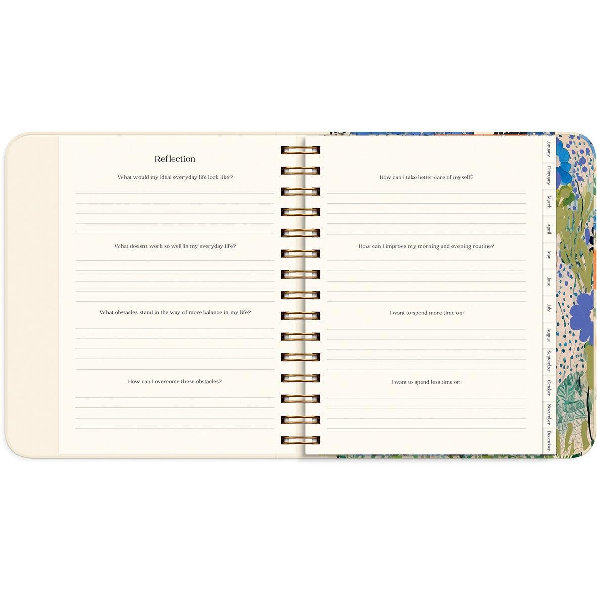 Öppnad almanacka med reflekterande frågor för året 2026, spiralbunden med färgglad utsida