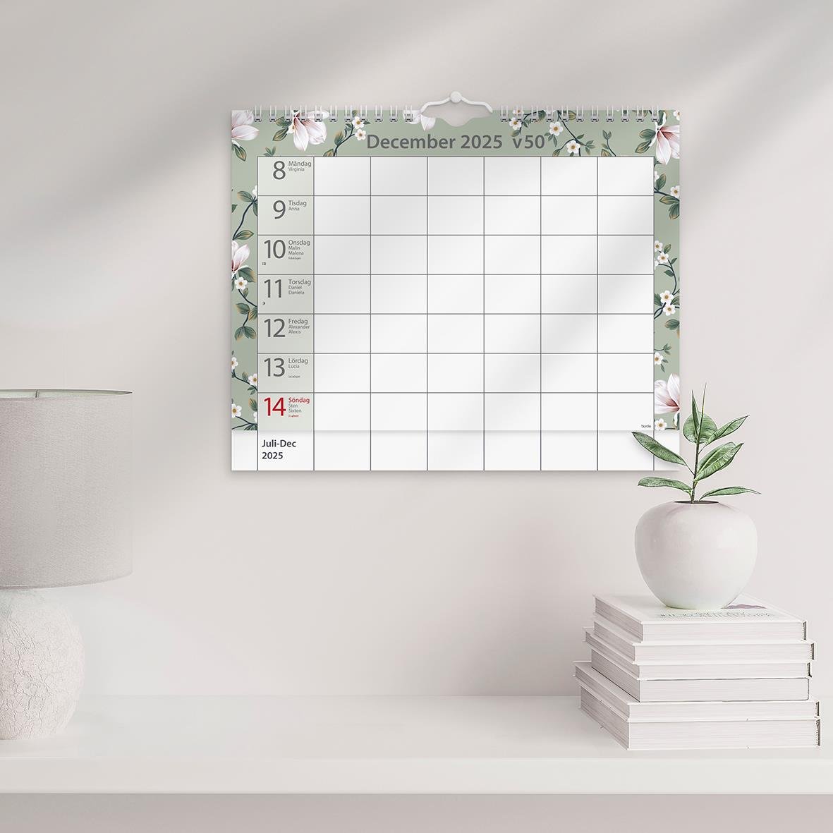 Väggkalender för december 2025 med blomsterdesign och plats för anteckningar