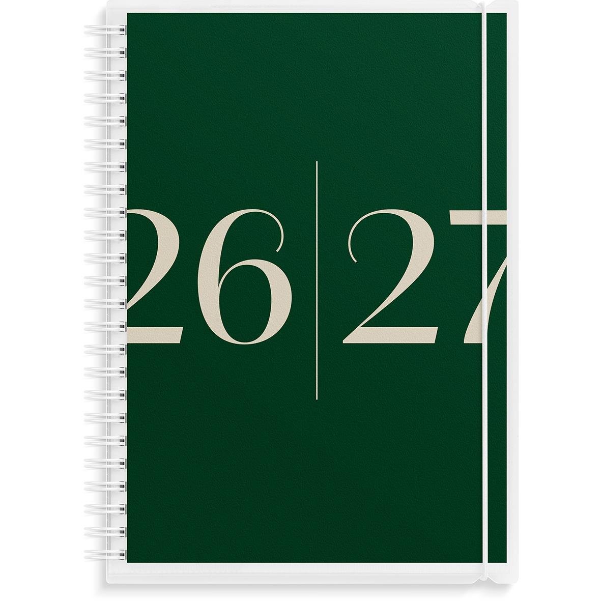 Studiealmanacka med blomsterdesign, glasögon, tangentbord, penn och mus på skrivbordet