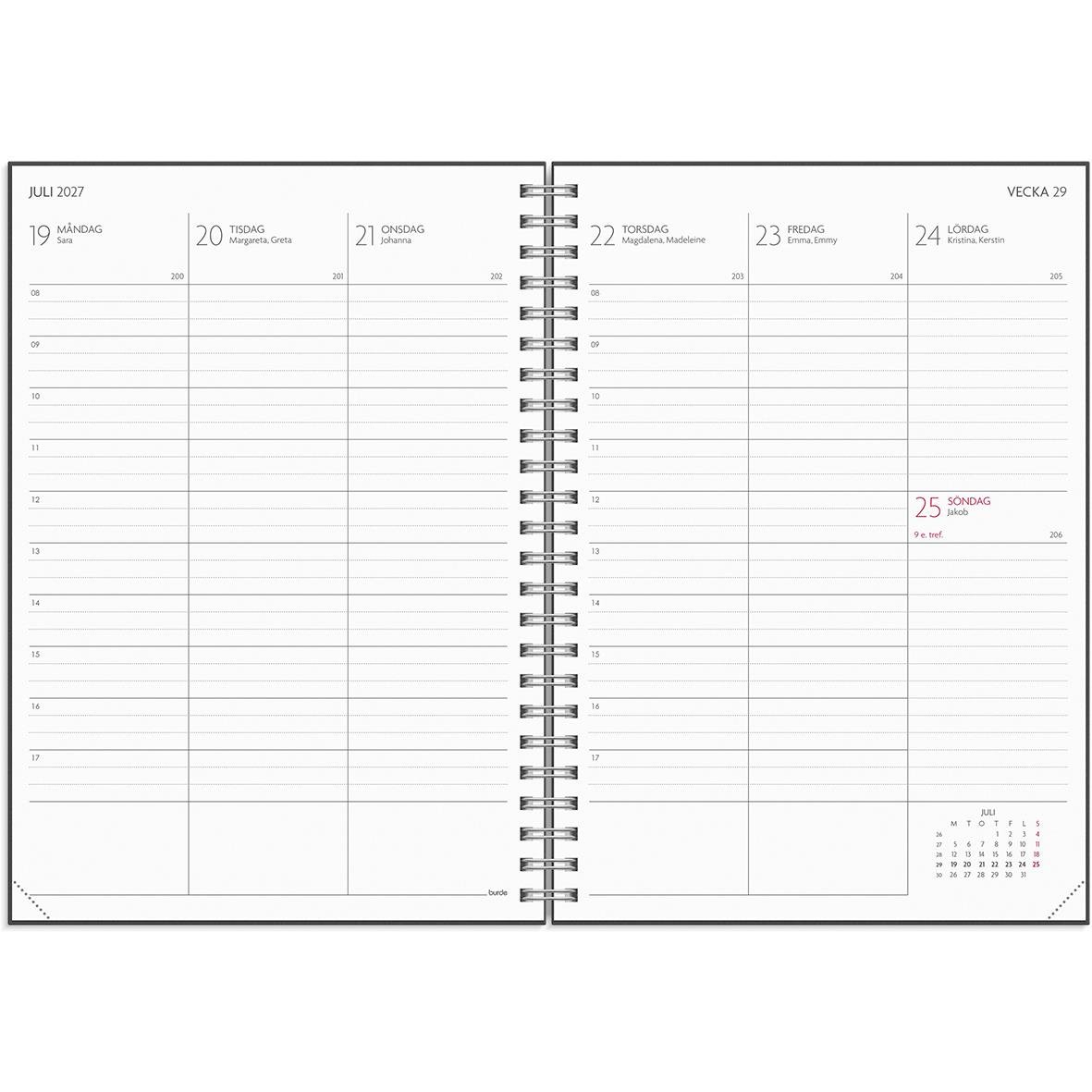 Svart studiealmanacka för 25-26 med spiralbindning och elastisk band på skrivbord med tangentbord och växt