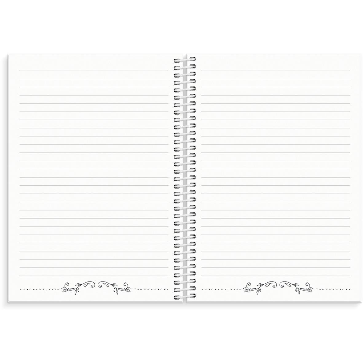 Öppen almanacka med prickad sida, spiralbindning i mitten och dekorativa detaljer i hörnen