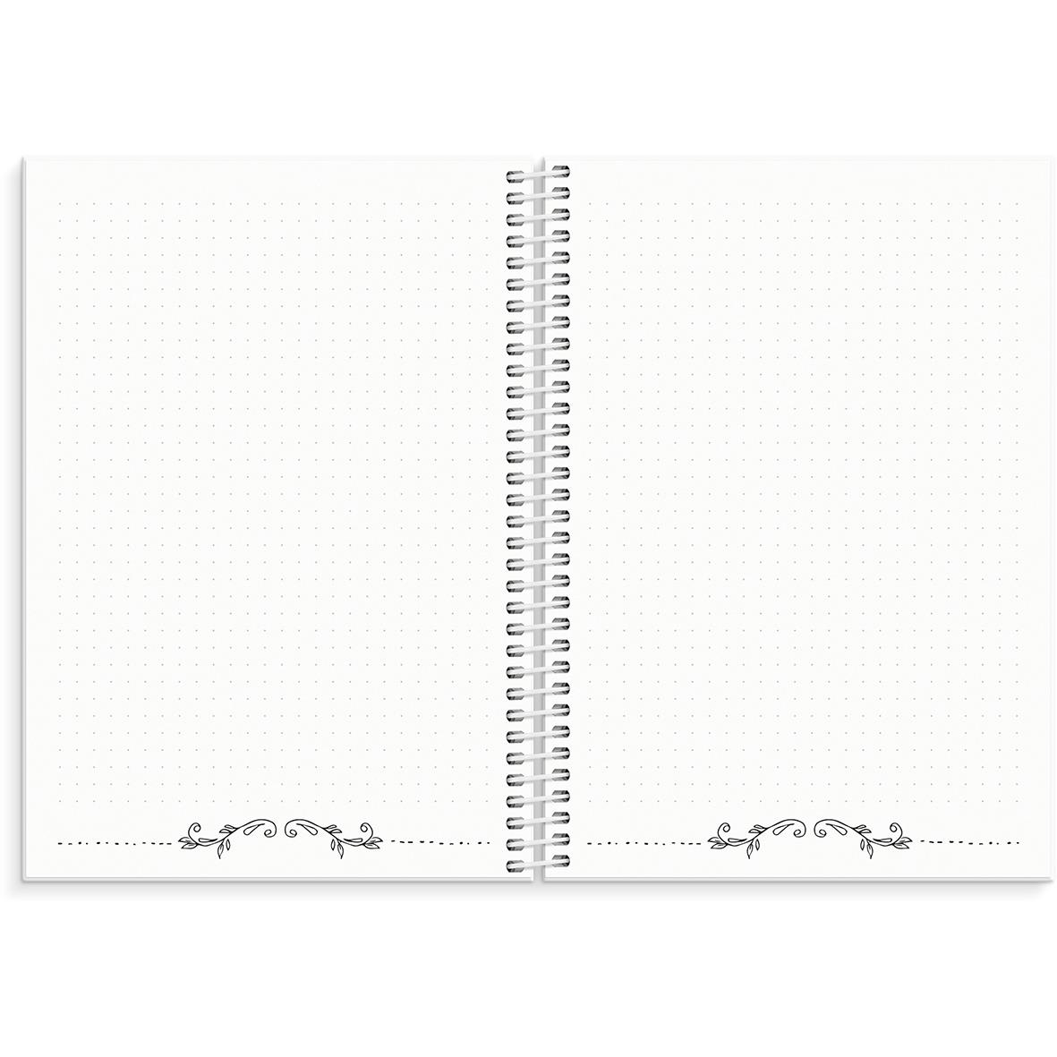 Öppen almanacka med prickad sida, spiralbindning i mitten och dekorativa detaljer i hörnen