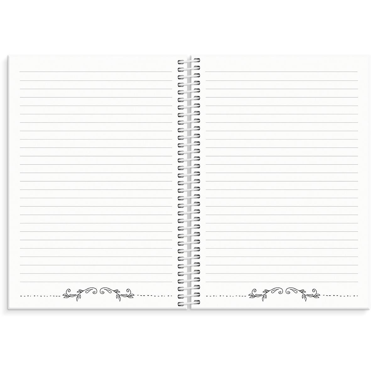 Öppet anteckningsblock med linjerade sidor och dekorativa detaljer längst ner