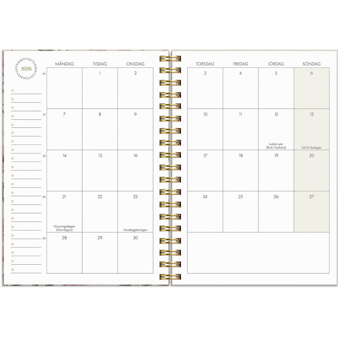 Öppen almanacka för 2026 med veckoplanering och plats för anteckningar i A6-format