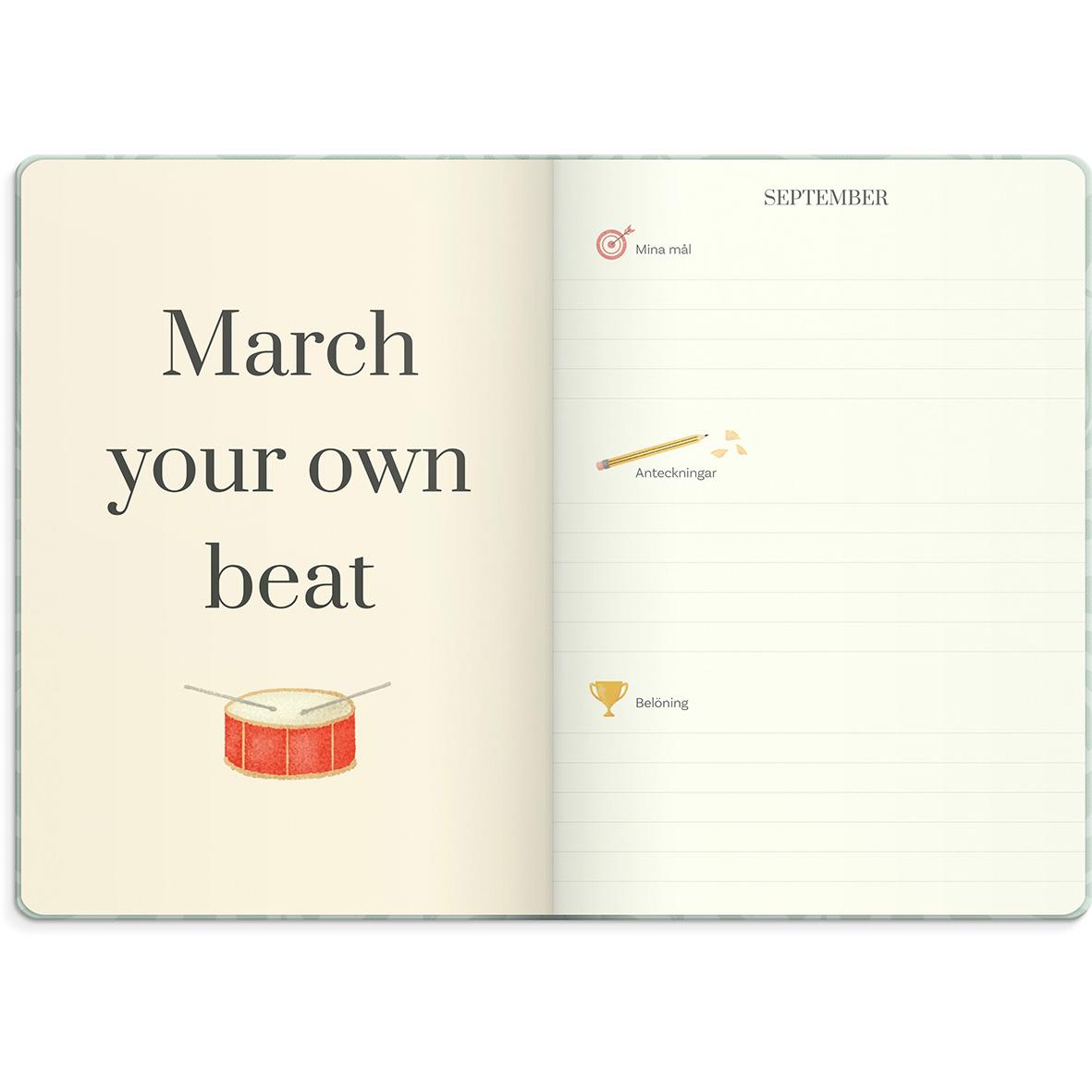 Öppnad kalender för 2026 med inspirerande citat och plats för mål och anteckningar i september