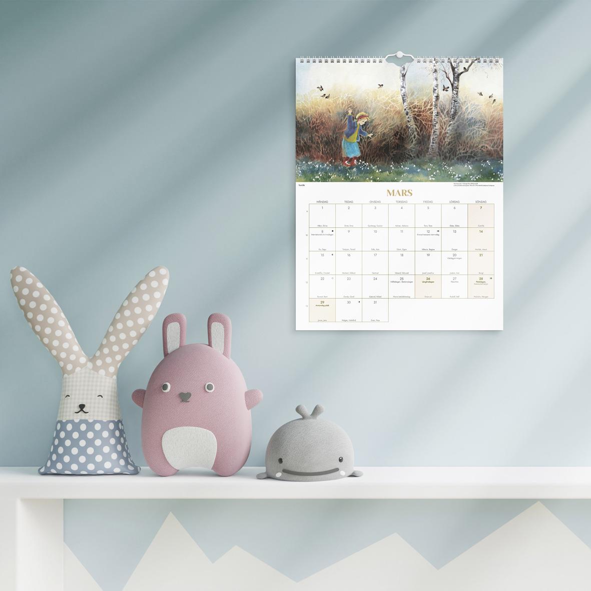 Väggkalender för 2026 med illustration av två personer på hästar i snölandskap och en bro