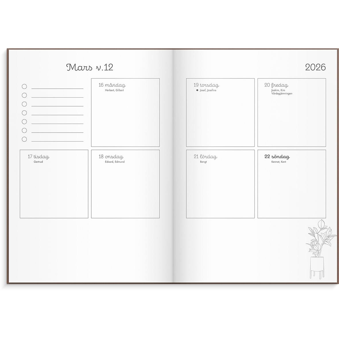 Årskalender för 2026 med veckor och plats för anteckningar, öppnad i mars, med växtillustration i hörnet