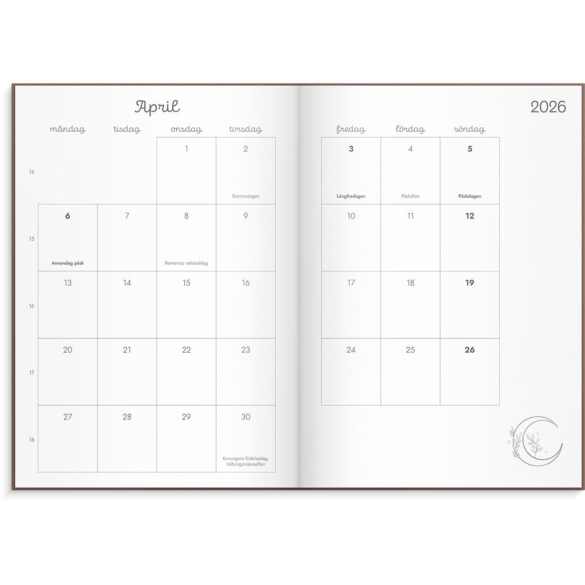 Öppnad almanacka för 2026 med april månad och kalender på två sidor