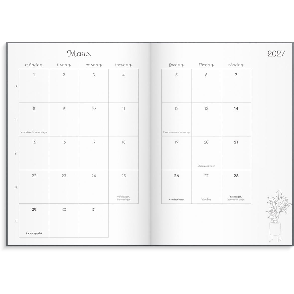 Öppnad almanacka för 2026 med kalender för januari till december, två sidor