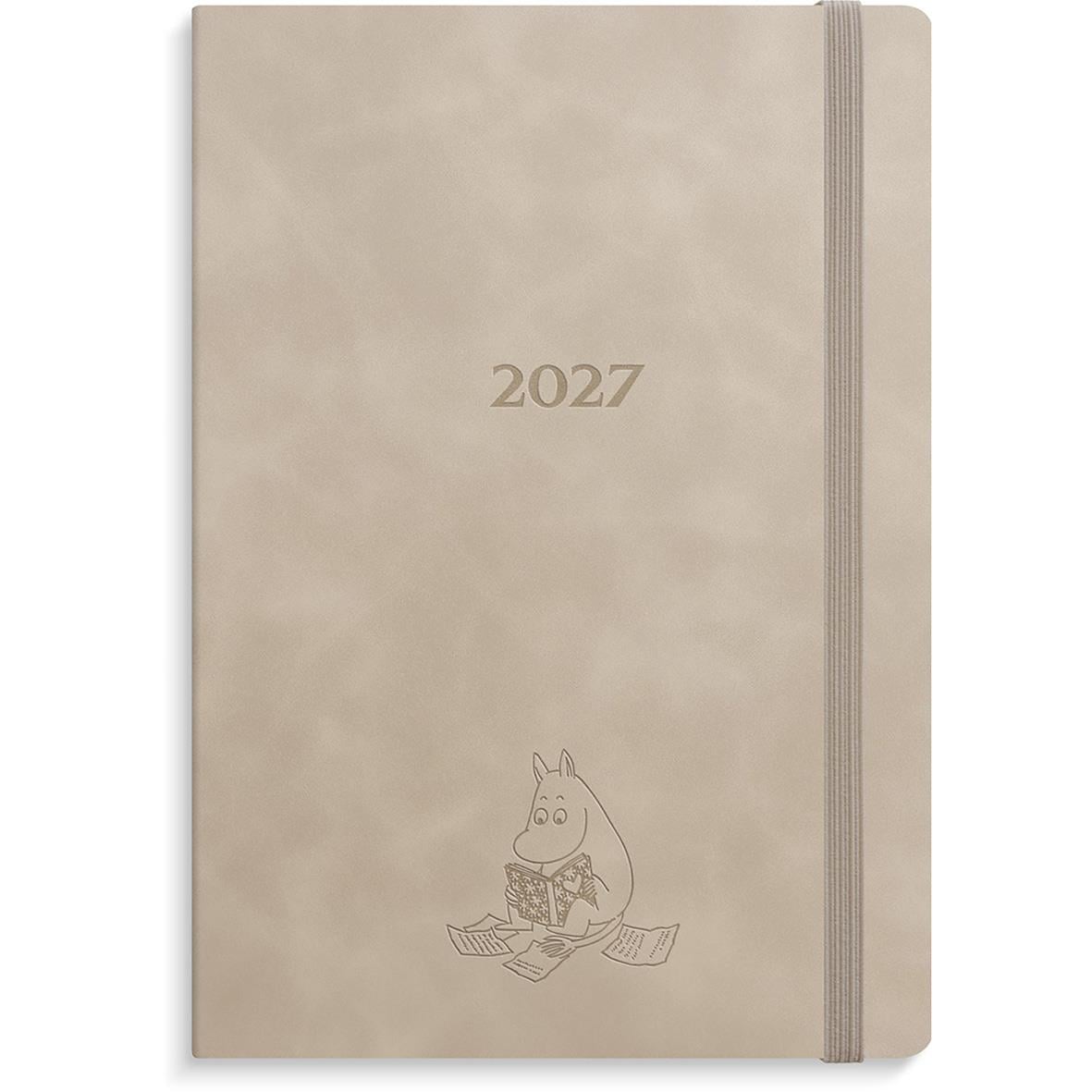 Beige almanacka för 2026 med Mumin-figur på framsidan