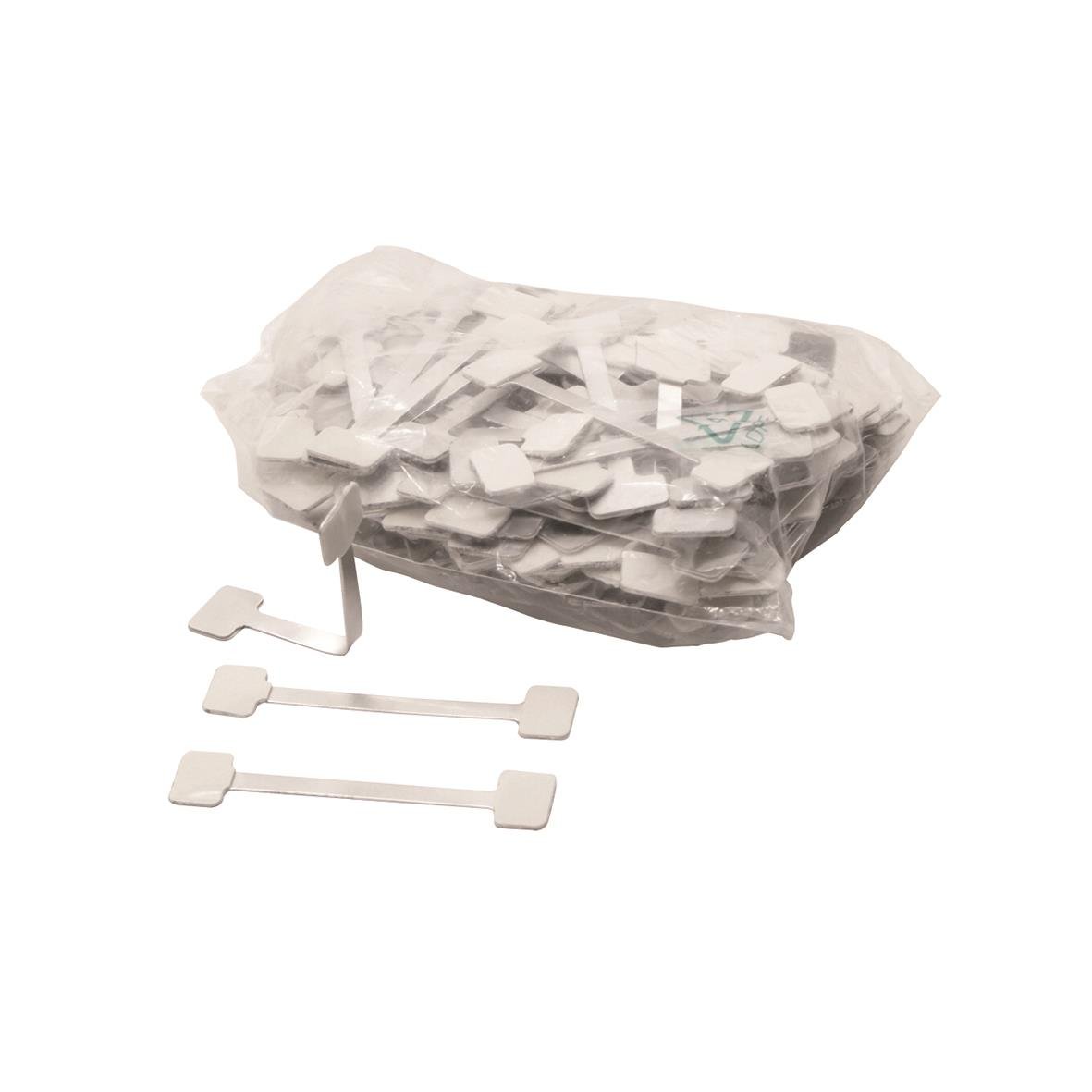 En påse med Twinstick 75 mm klisterlappar och tre lösa lappar framför