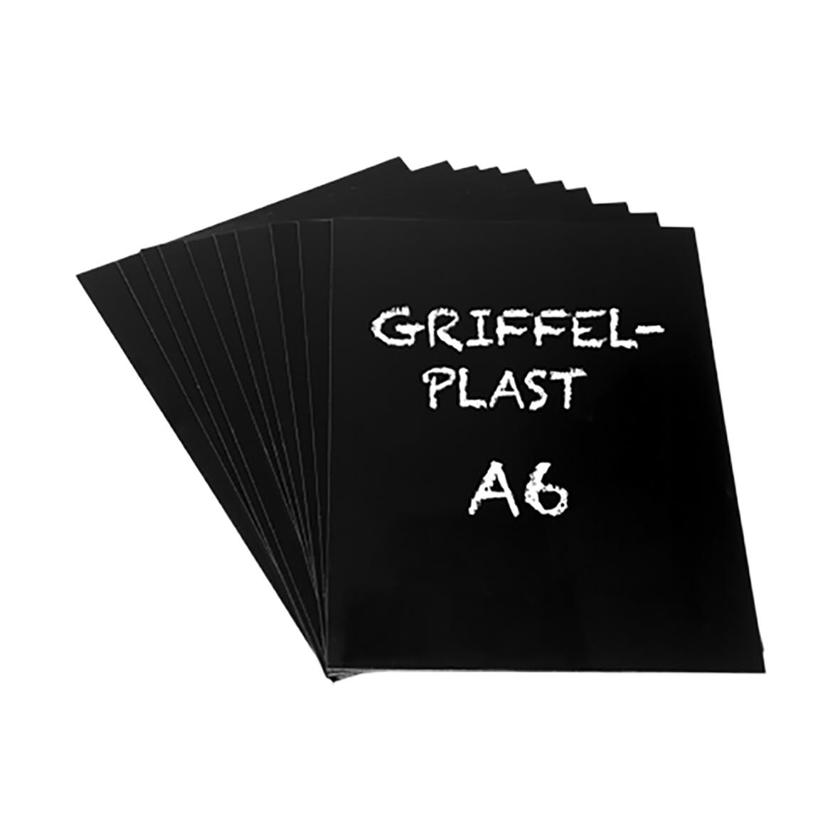 Svarta griffelplast A6-blockar staplade på varandra