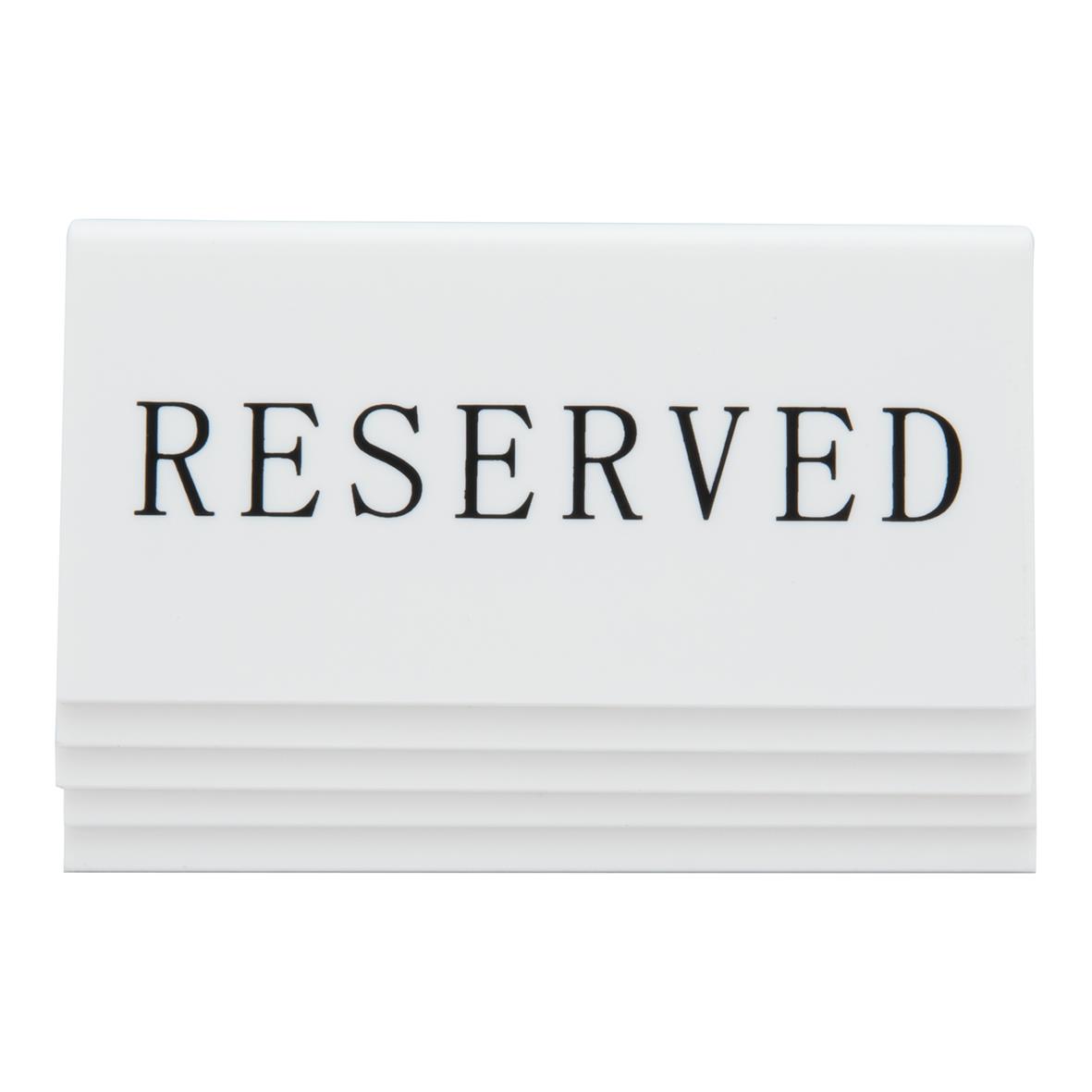Vit akrylskylt med texten RESERVED i svart, mått 5x10x4,5cm