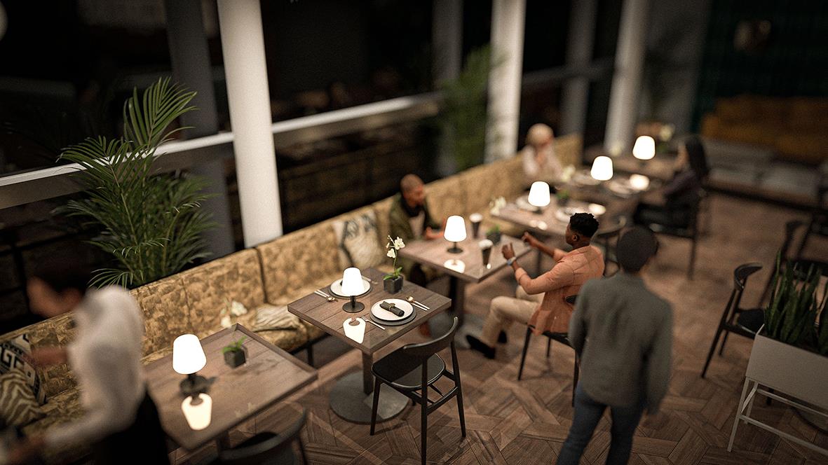 Bordslampa Securit med griffeltavla på ett bord i ett restaurang- eller caféutrymme