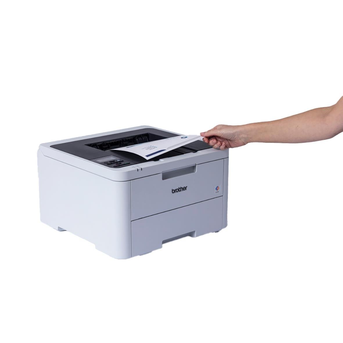 Laserskrivare Brother HL-L3220CW med hand som placerar papper i maskinen