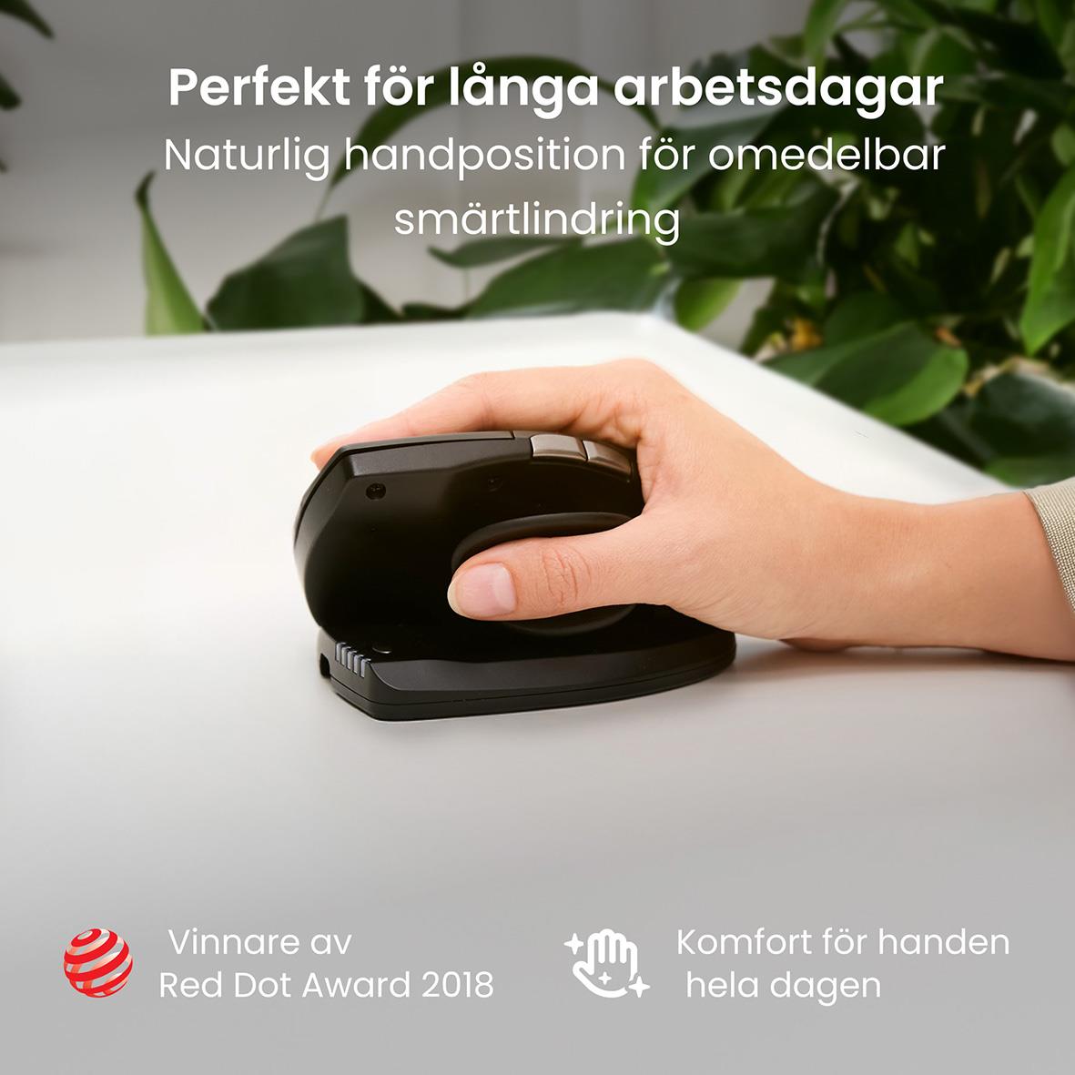 Ergonomisk trådlös högerhandsmus RollerMouse Unimouse på skrivbord med gröna växter i bakgrunden