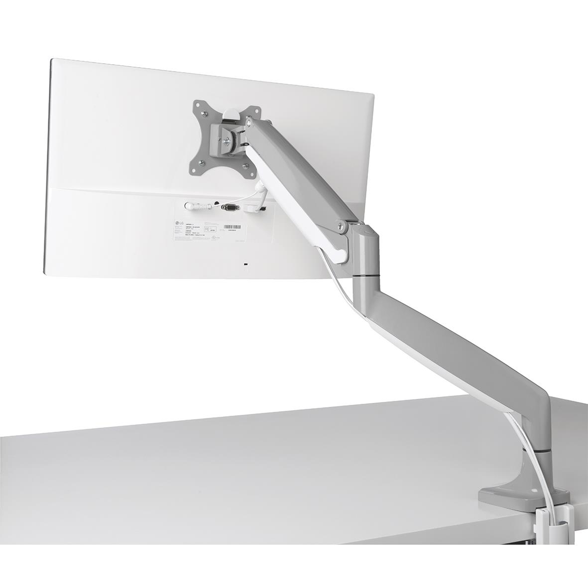 Grå Kensington SmartFit One Touch monitorarm monterad på skrivbord