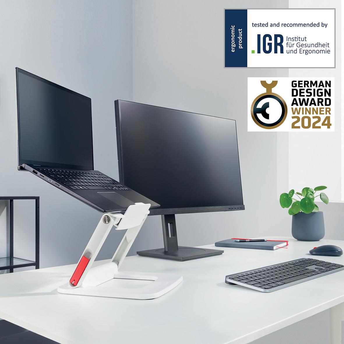 Justerbart vitt laptopställ Leitz Ergo på skrivbord med laptop, skärm, tangentbord och växt