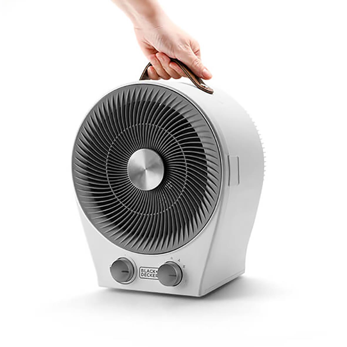 Värmefläkt Black+Decker 2IN1 vit med hand som justerar inställningar