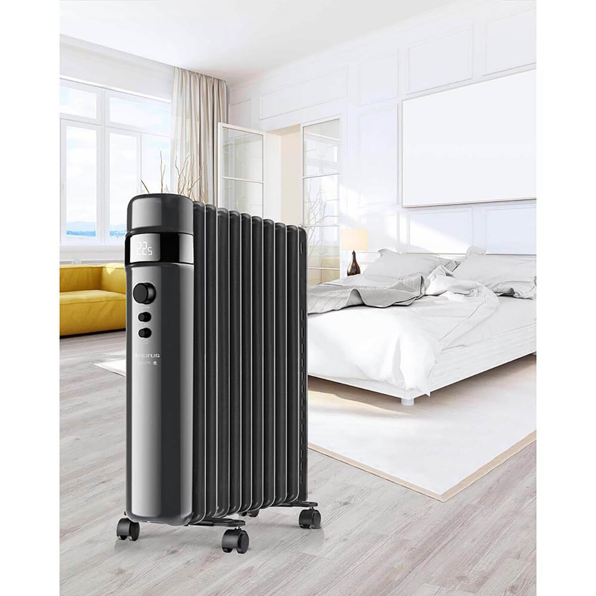 Element Taurus oljefyllt radiator i svart i ett modernt sovrum