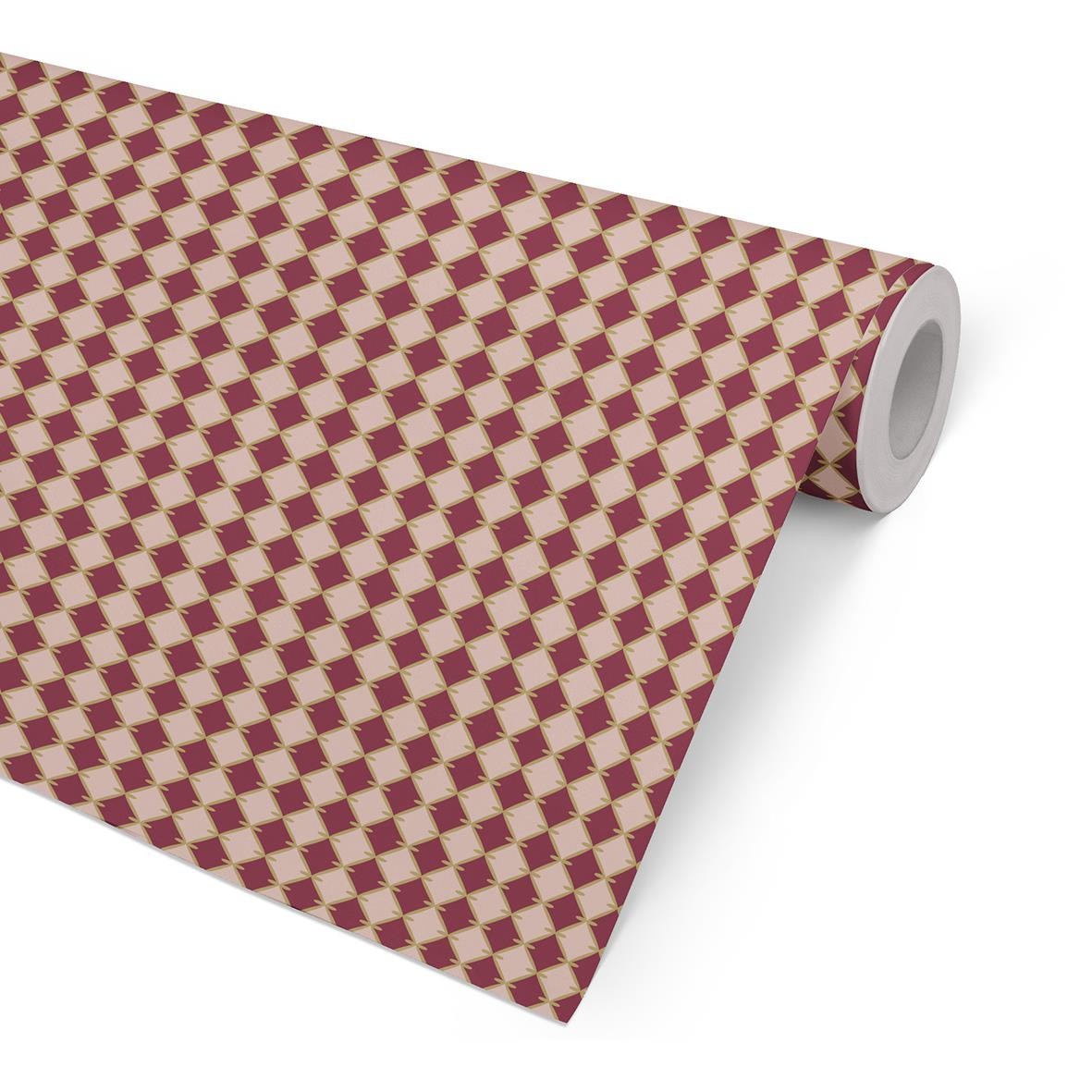 Julpapper med rött och beige diamantmönster på rulle