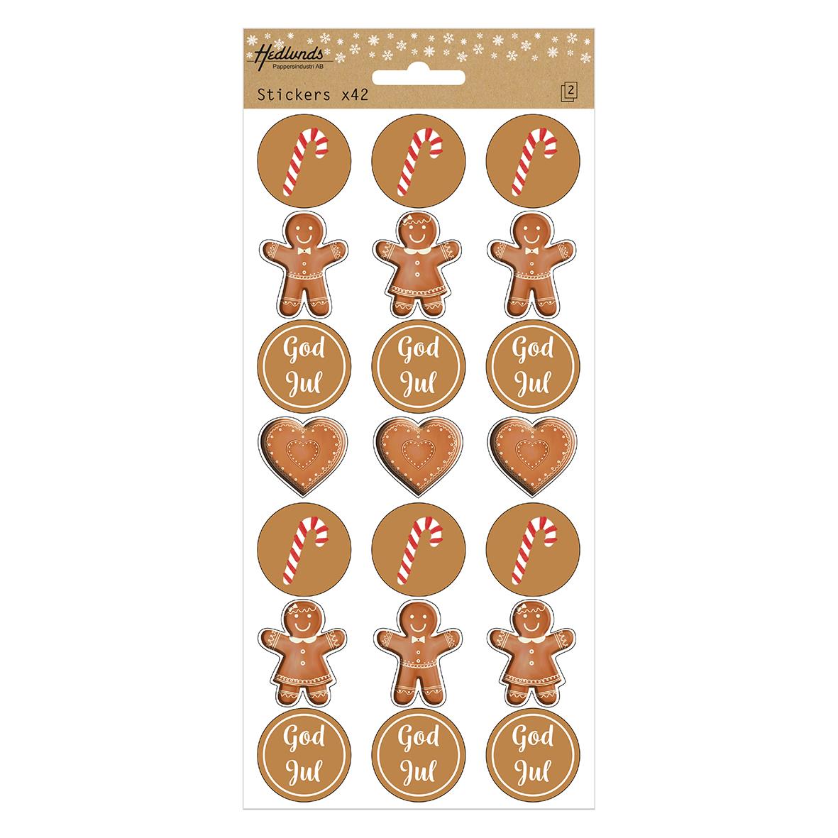 Ark med 42 julklistermärken med pepparkaksgubbar, pepparkaksgummor, polkagrisar och God Jul-motiv
