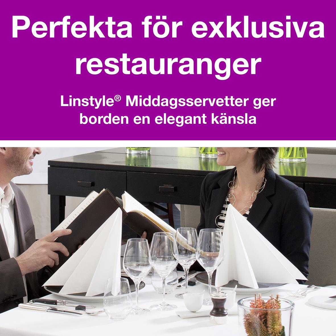 Vit servett i linstyle 39x39cm på elegant restaurangbord med glas och duk