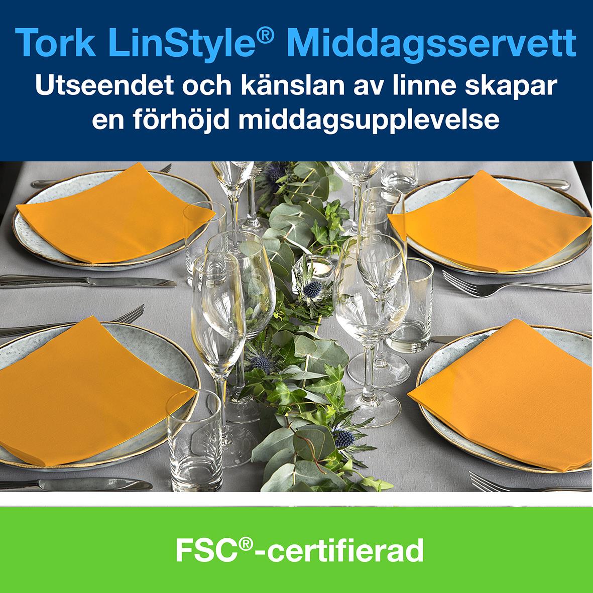 Servett Tork LinStyle Orange 39x39cm på dukning med glas och tallrikar, grönt FSC-märkt