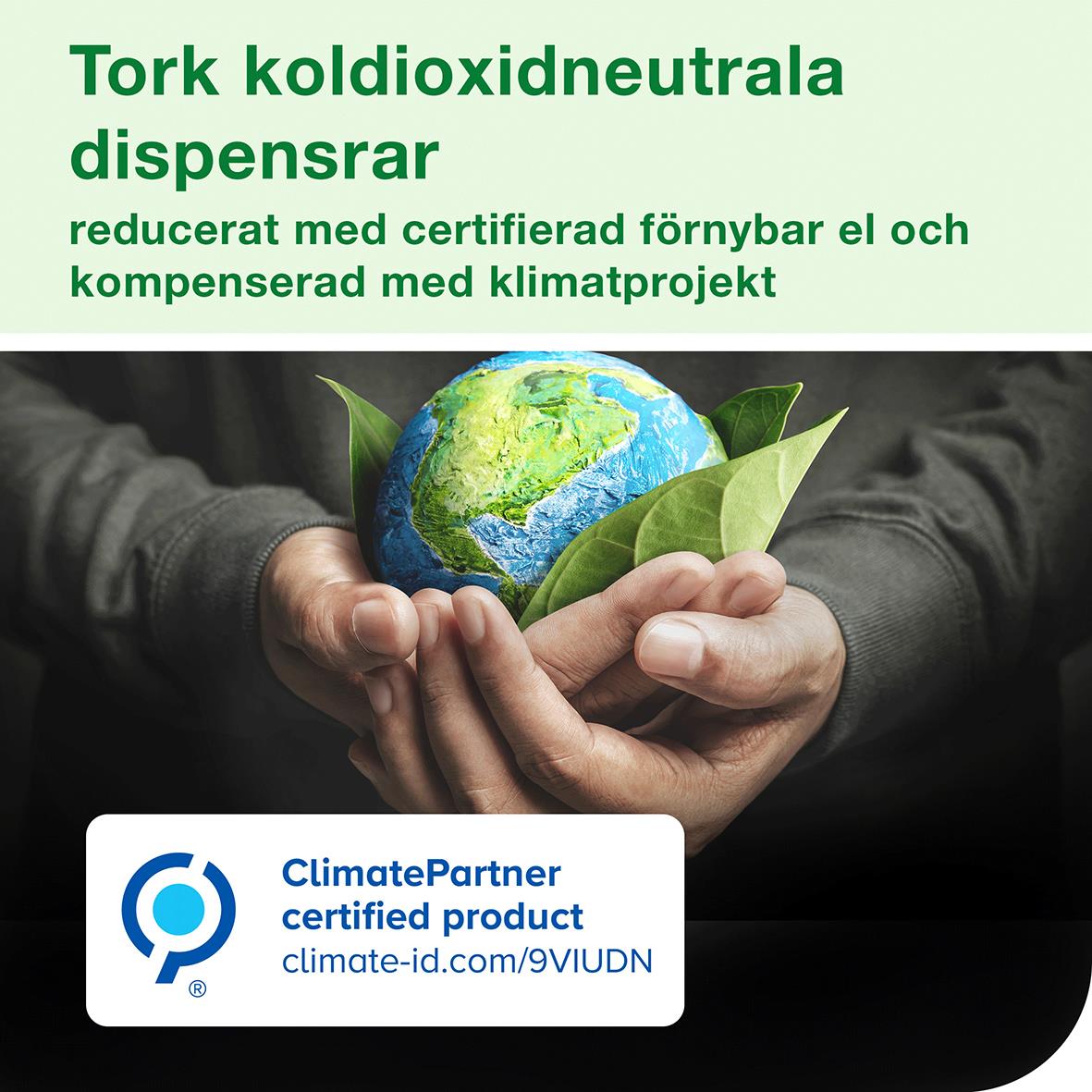 Dispenser för pappershanddukar Tork H5 PeakServe Mini i vitt med miljöbudskap om koldioxidneutralitet och klimatprojekt