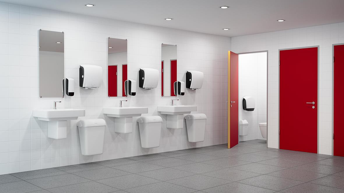 Vitt handdispenser för pappershanddukar Katrin System M2 i en offentlig toalett