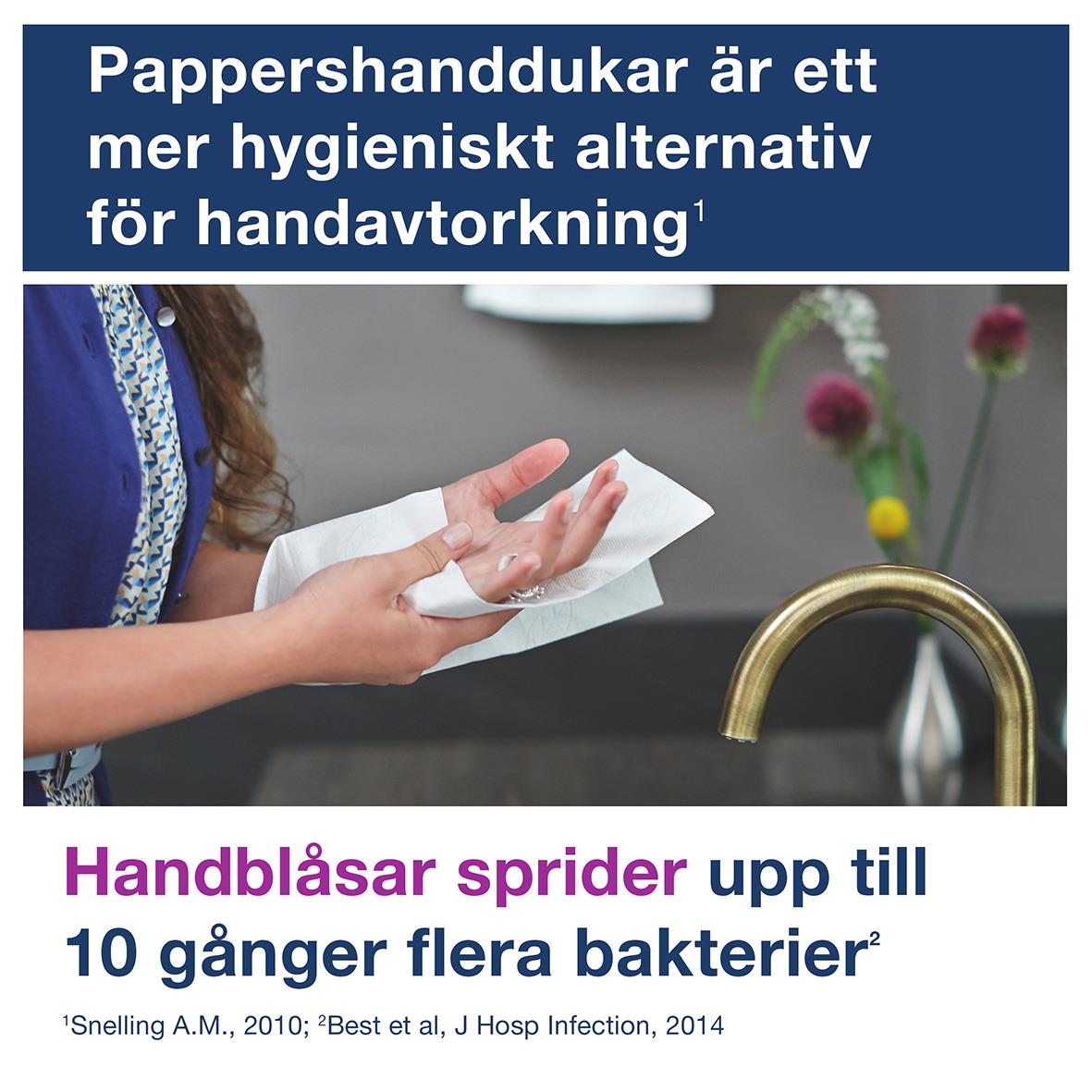Person använder dispenser för pappershanddukar i kök eller badrum, svart automatisk PeakServe Tork H5