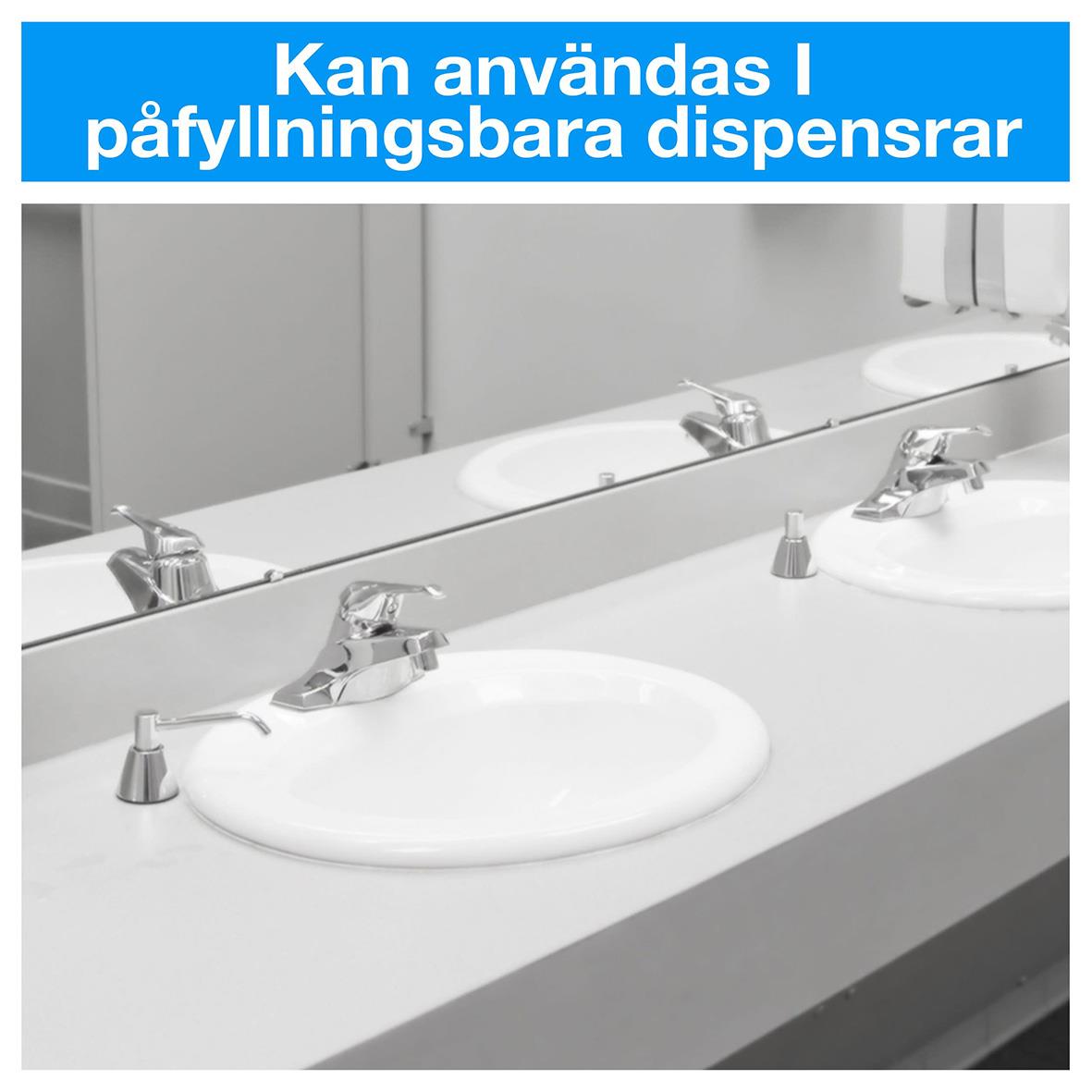 Två vita handfat med spegel och dispenser för flytande tvål på en badrumssväng