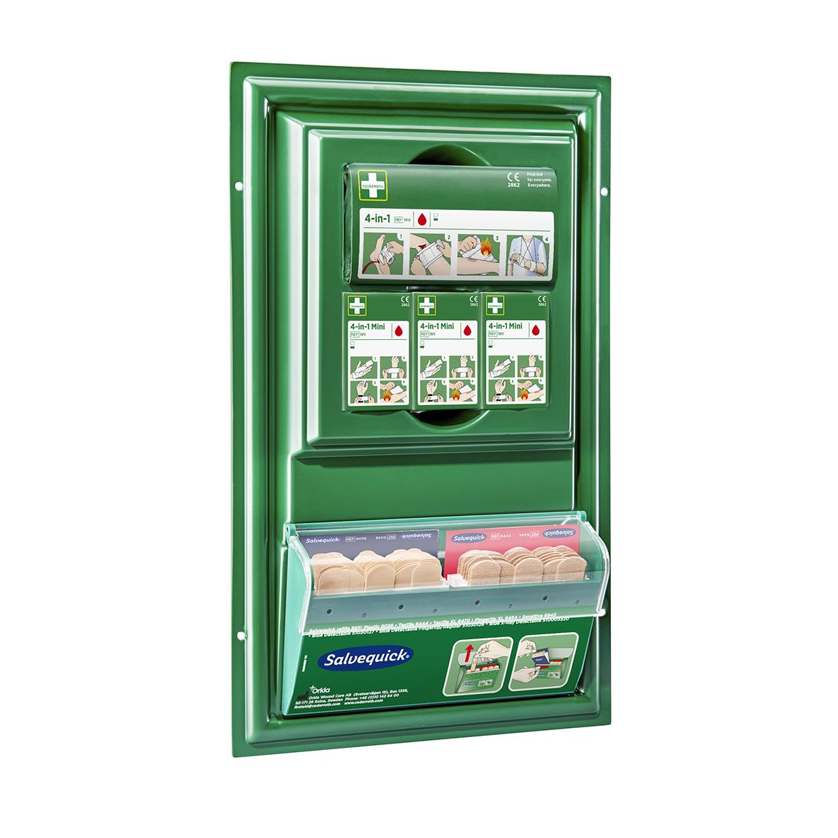 Första hjälpen station med instruktionsskylt och förbandslåda i grönt väggskåp