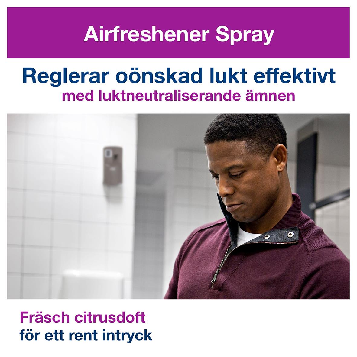 Man använder Tork A1 Premium citrusdoft luftfräschare spray i ett badrum