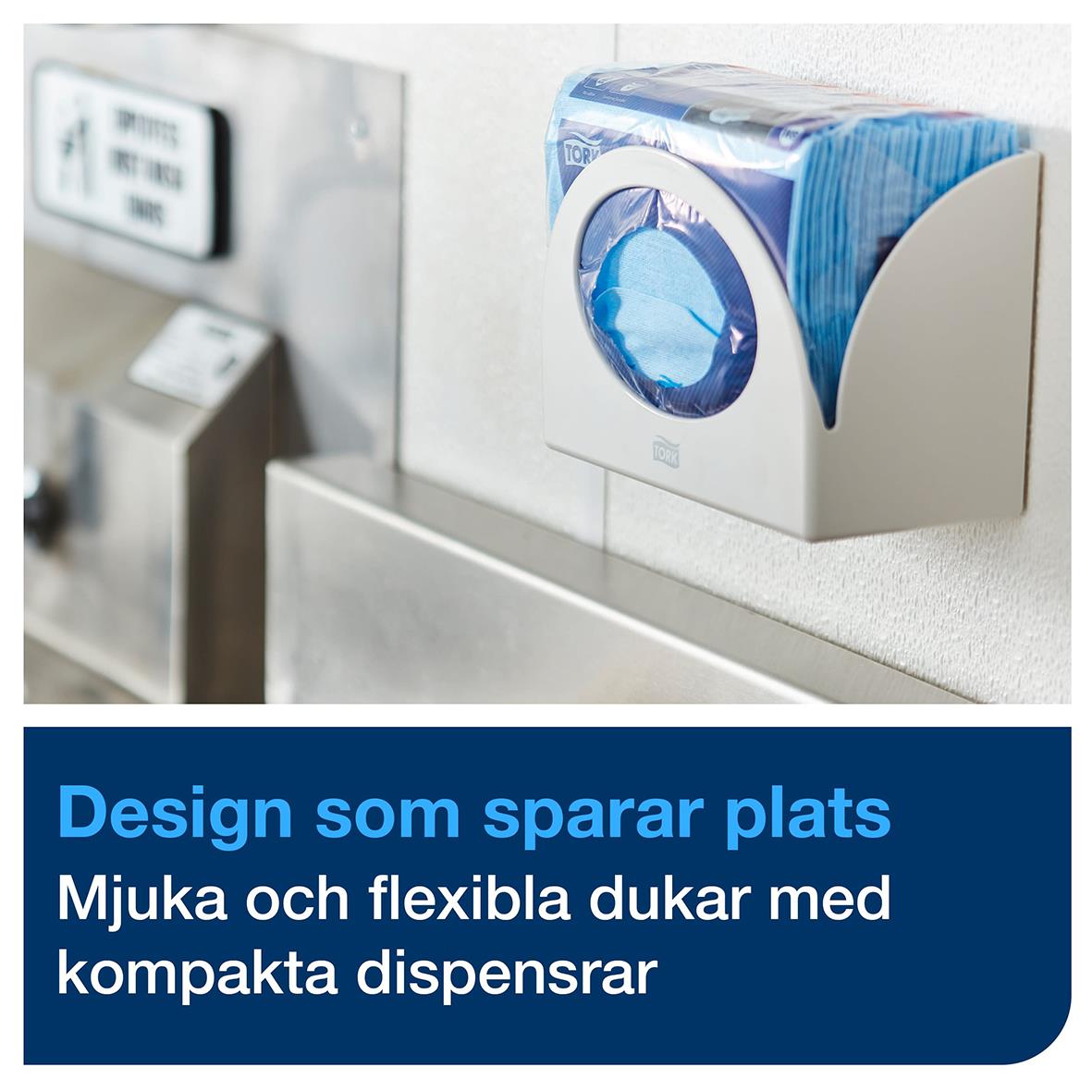 Blå rengöringsduk Tork W8 i kompakt dispenser på vägg, 30x38,5cm