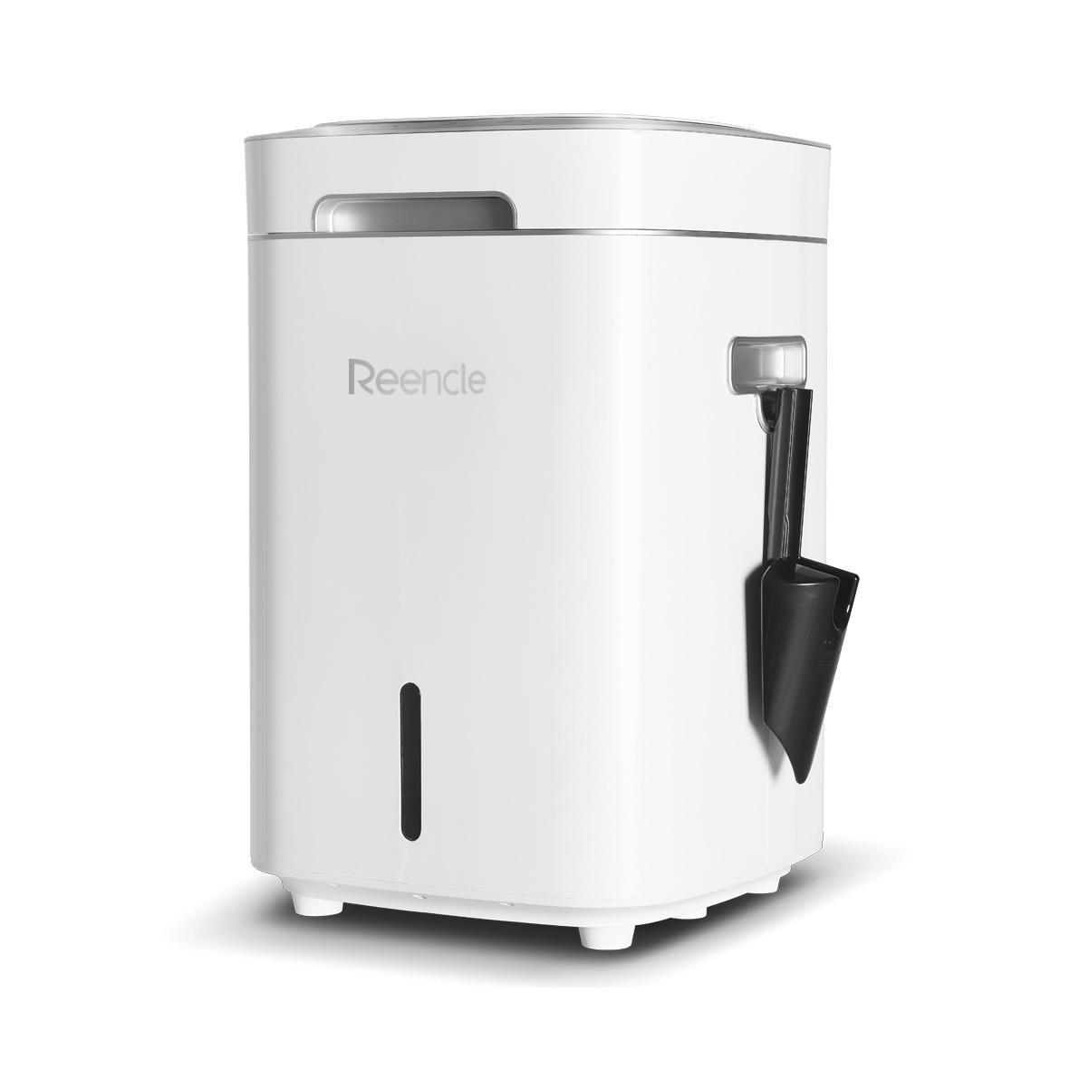 Vit kompostbehållare med svart skopa och tydlig nivåindikator