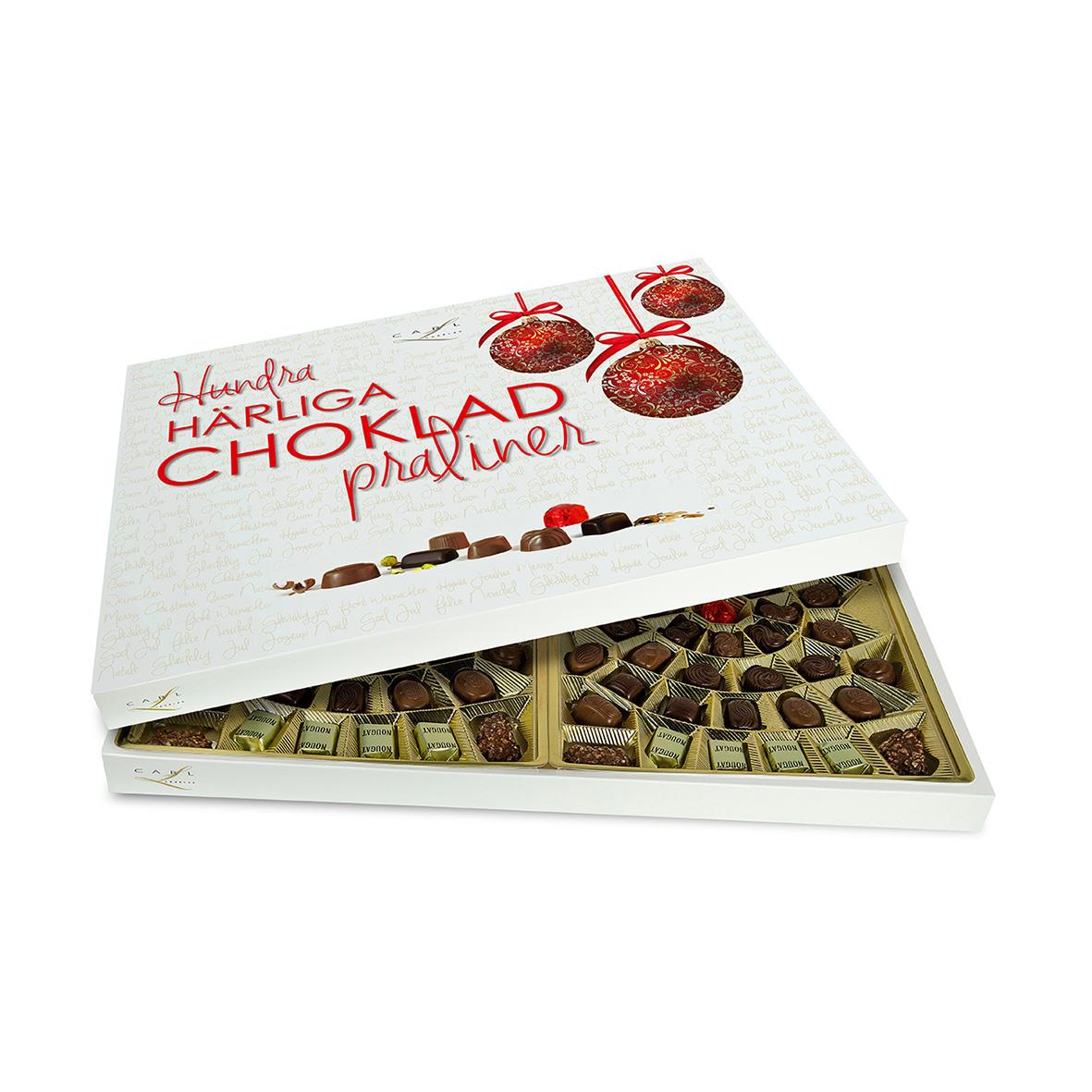 Öppen låda med 860g chokladpraliner i olika former och smaker