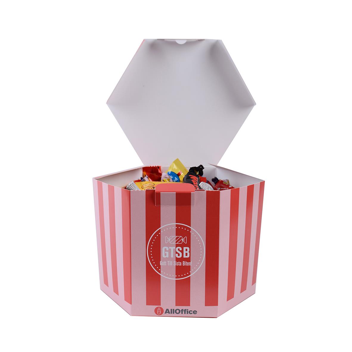 Stor burk med godis i rödvita ränder och lock som är öppnat