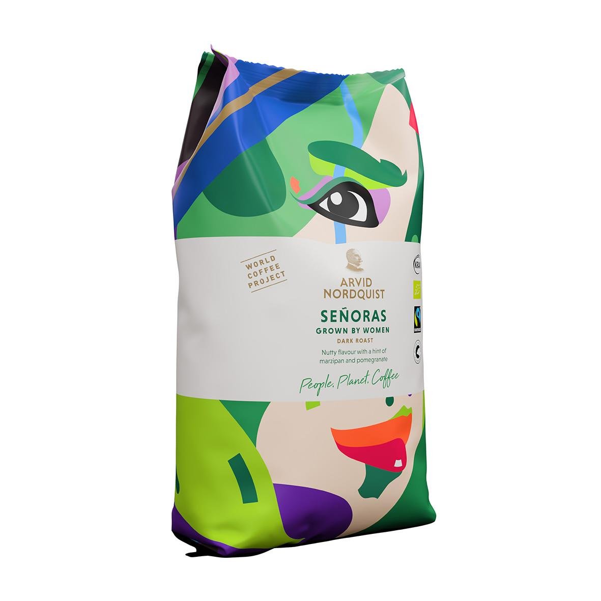 Kaffe från Arvid Nordquist med design av en kvinnlig ansiktsillustration i gröna, blå och röda nyanser